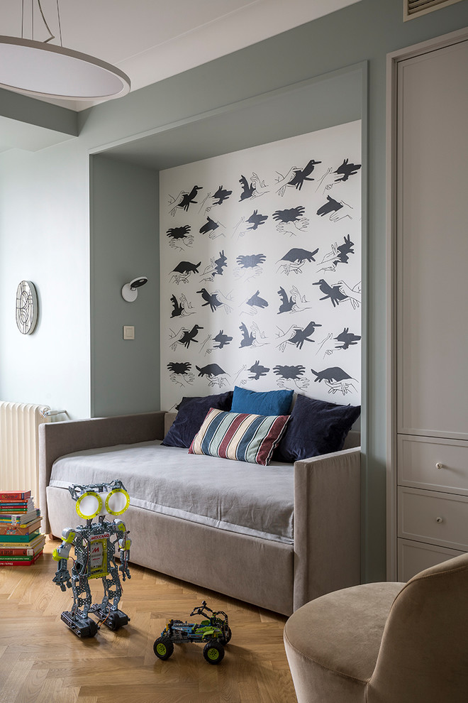 Photo of a transitional kids' room for boys in Moscow with medium hardwood floors.