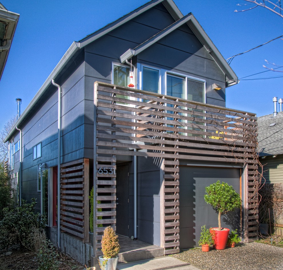 Mid-sized contemporary two-storey grey exterior in Seattle with concrete fiberboard siding.