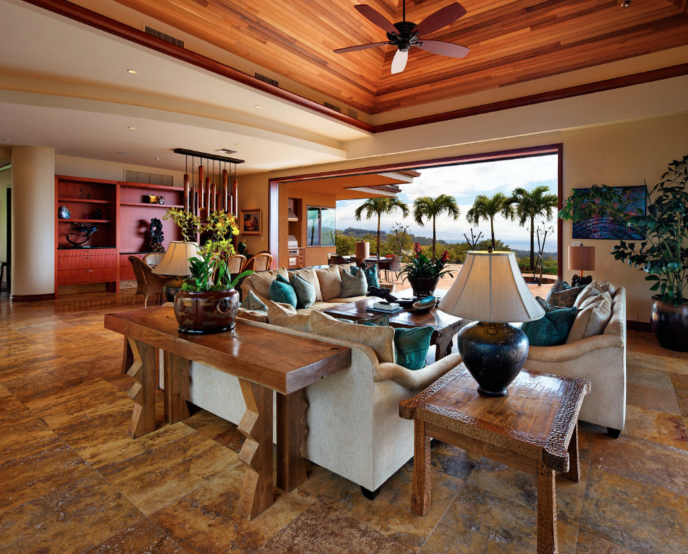 Photo of a large tropical formal open concept living room in Hawaii with beige walls, no tv, no fireplace and brown floor.
