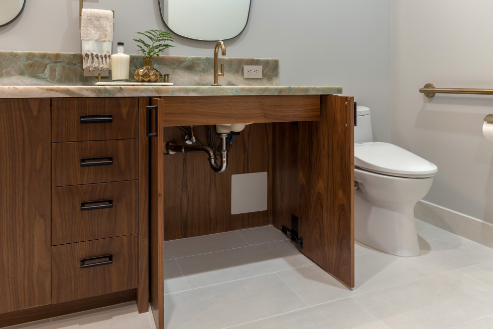 Photo of a large modern master bathroom in San Francisco with flat-panel cabinets, brown cabinets, an open shower, a bidet, green tile, stone slab, grey walls, vinyl floors, an undermount sink, quartzite benchtops, grey floor, a hinged shower door, green benchtops, a shower seat, a double vanity and a built-in vanity.