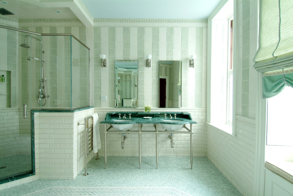 This is an example of an expansive modern master bathroom in Boston with a console sink, a double shower, green tile, ceramic tile, green walls, mosaic tile floors and marble benchtops.