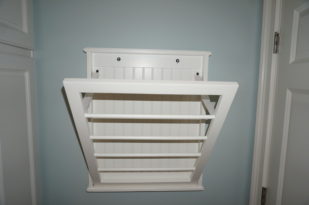 Inspiration for a small transitional home design remodel with raised-panel cabinets, white cabinets and blue walls