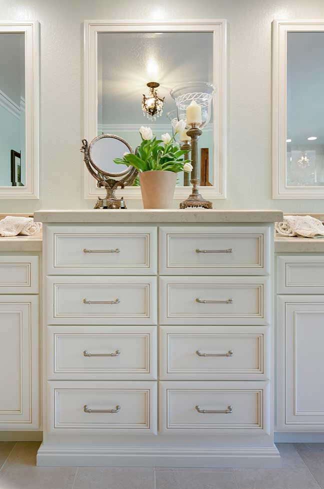 This is an example of a large traditional master bathroom in San Francisco with recessed-panel cabinets, beige cabinets, an undermount tub, an alcove shower, a two-piece toilet, beige tile, porcelain tile, green walls, porcelain floors, an undermount sink, engineered quartz benchtops, beige floor, a hinged shower door, beige benchtops, a shower seat, a double vanity and a built-in vanity.