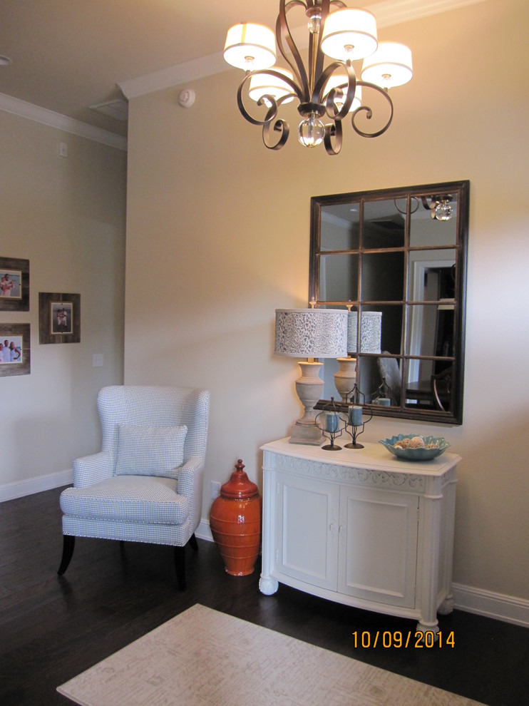 Inspiration for a mid-sized transitional dark wood floor foyer remodel with beige walls