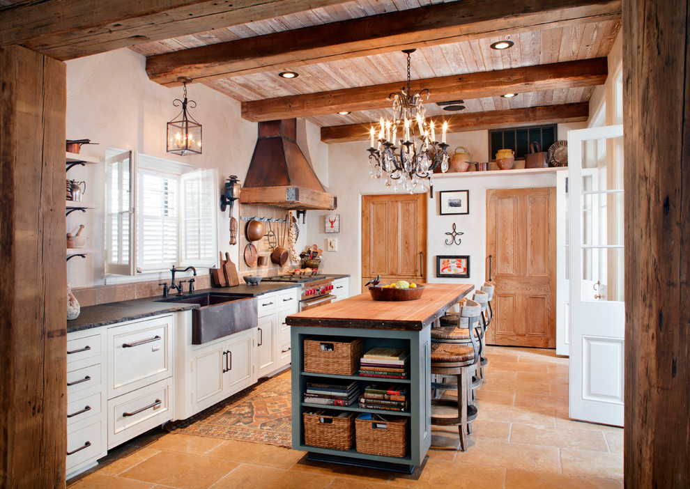 Photo of a country kitchen in Other with a farmhouse sink, recessed-panel cabinets, with island and white cabinets.