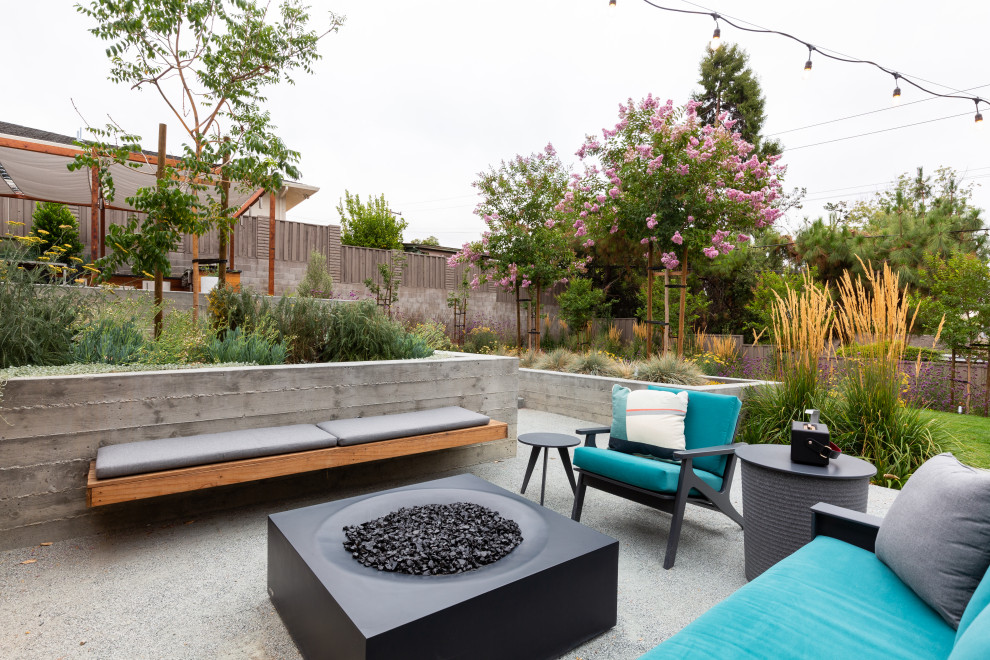 Design ideas for a large midcentury backyard patio in San Francisco with with fireplace and decomposed granite.