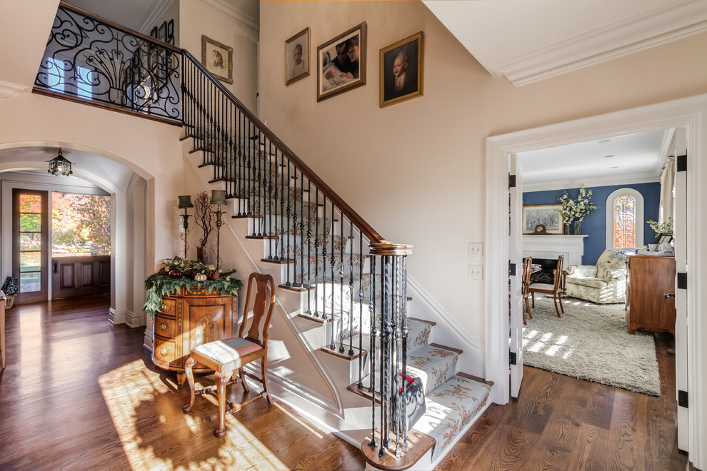 Inspiration for a traditional wood straight staircase in Nashville with wood risers.