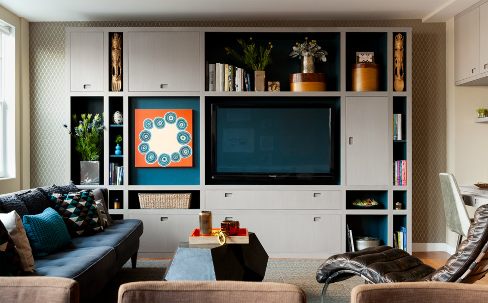 Family room - mid-sized contemporary enclosed light wood floor family room idea in New York with no fireplace and a media wall