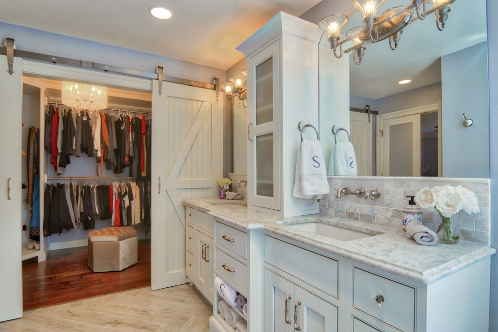 Photo of a mid-sized traditional master bathroom in Philadelphia with furniture-like cabinets, white cabinets, a claw-foot tub, an alcove shower, a one-piece toilet, gray tile, subway tile, blue walls, ceramic floors, an undermount sink, engineered quartz benchtops, grey floor and a hinged shower door.