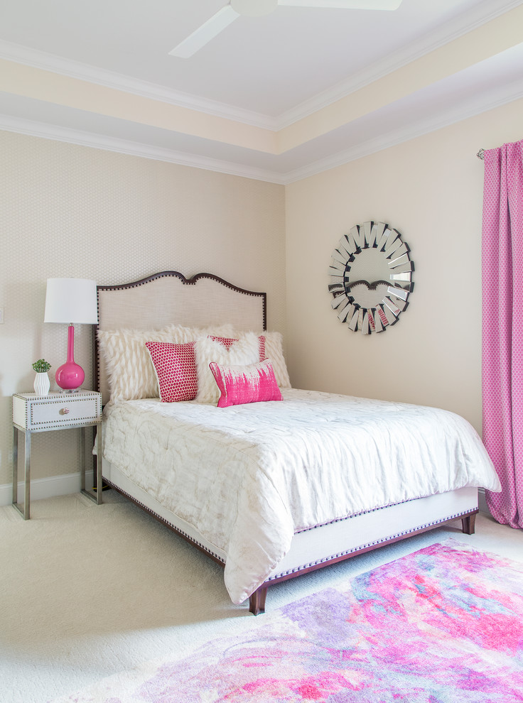 Photo of a mid-sized transitional guest bedroom in Other with beige walls, carpet and beige floor.