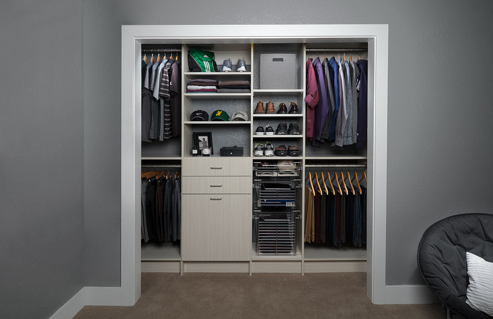 Small transitional men's built-in wardrobe in Phoenix with flat-panel cabinets, light wood cabinets and carpet.