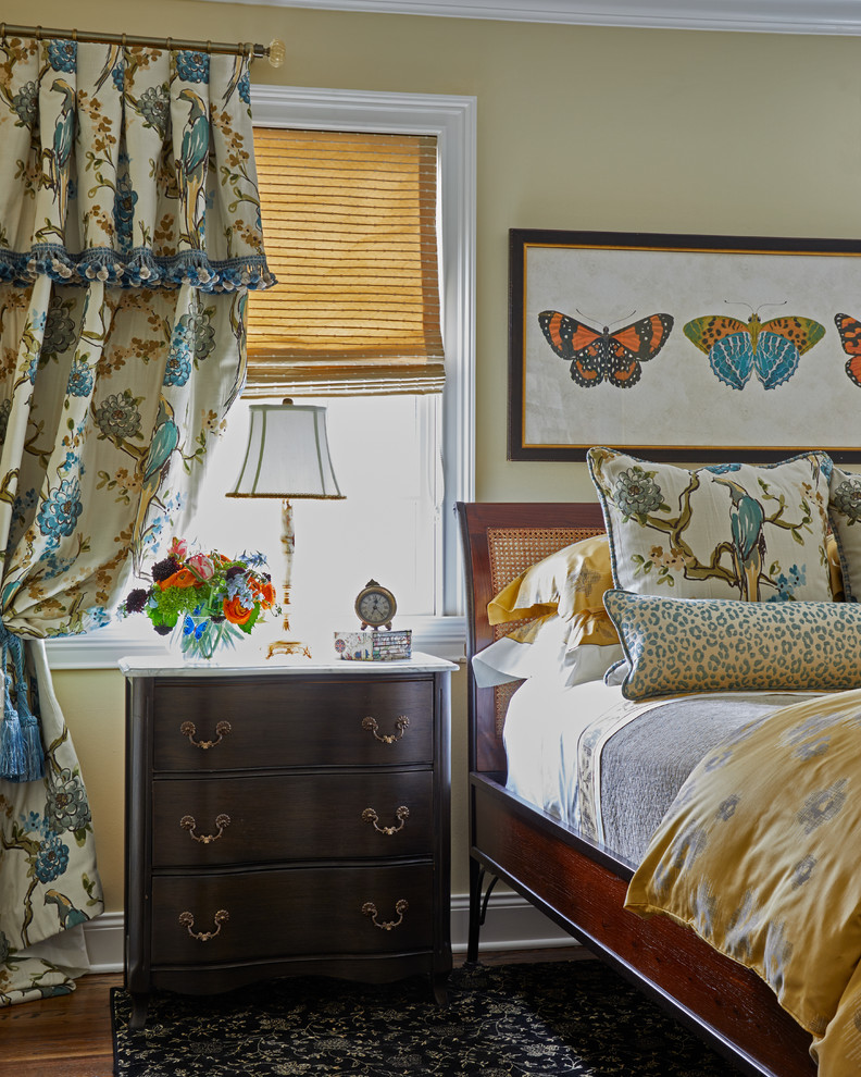 Traditional Rumson Home - This space is intended for the homeowner's daughter for her occasional visits. The space was created to be a happy and welcoming room for her to come back to. Inspiration for the palette was drawn from the  blue and gold bird fabric seen on the drapery and again on the accent pillows. The gold was repeated in the duvet, the roman shades and the patterned area rug.  Feminine patterns and motifs were selected;  florals, butterflies and leopard.