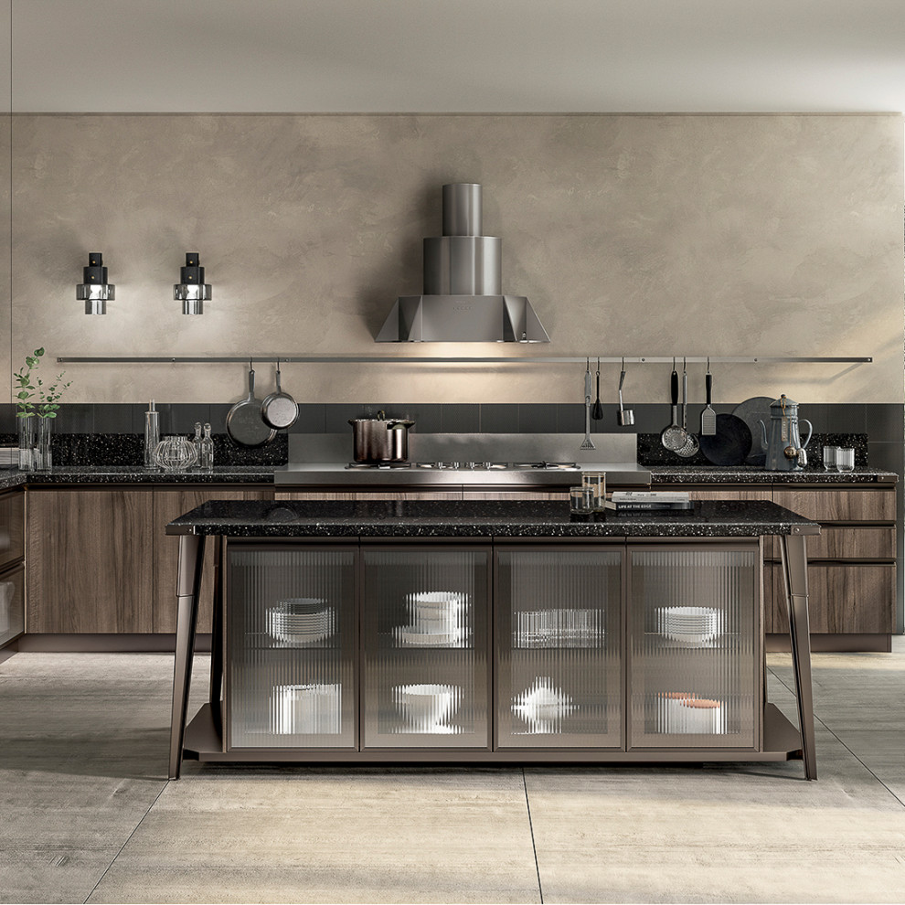 Design ideas for a large industrial l-shaped open plan kitchen in Dublin with a built-in sink, flat-panel cabinets, brown cabinets, cement flooring, black splashback, stainless steel appliances, an island, grey floors and black worktops.