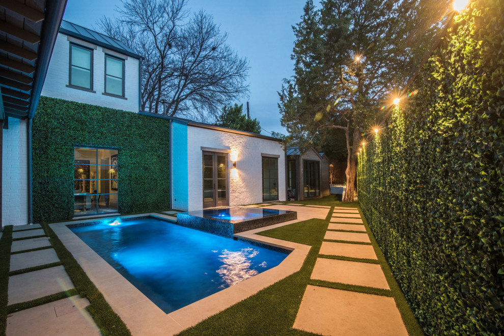 Contemporary side yard rectangular pool in Dallas with a hot tub.