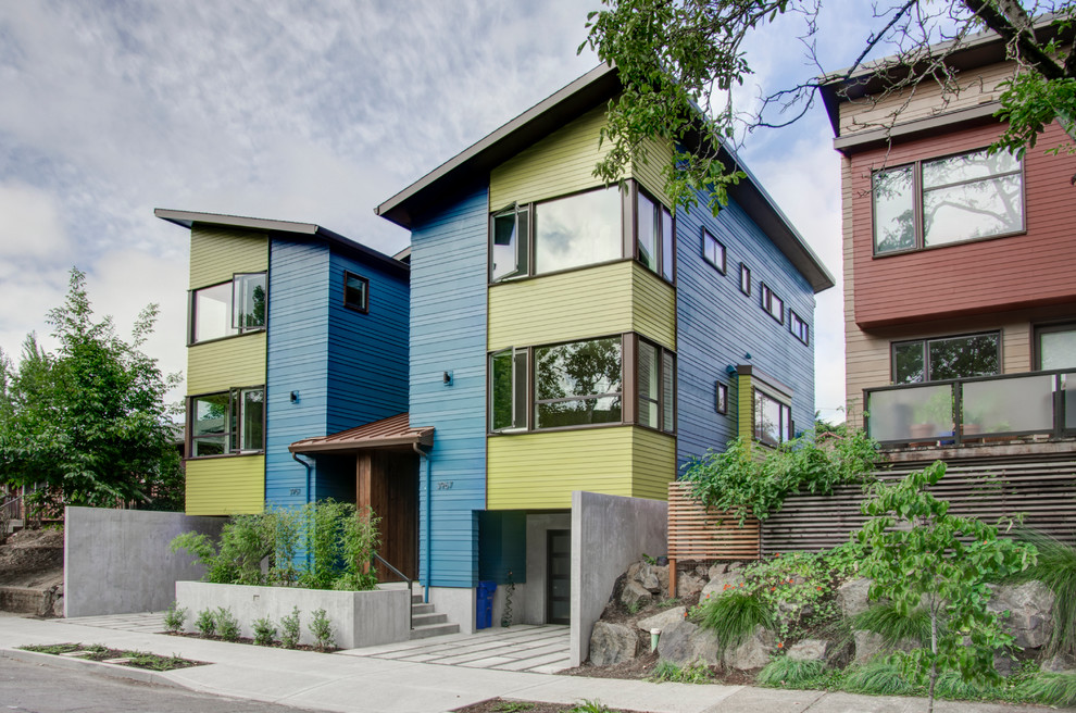 This is an example of a modern three-storey blue exterior in Portland with concrete fiberboard siding.
