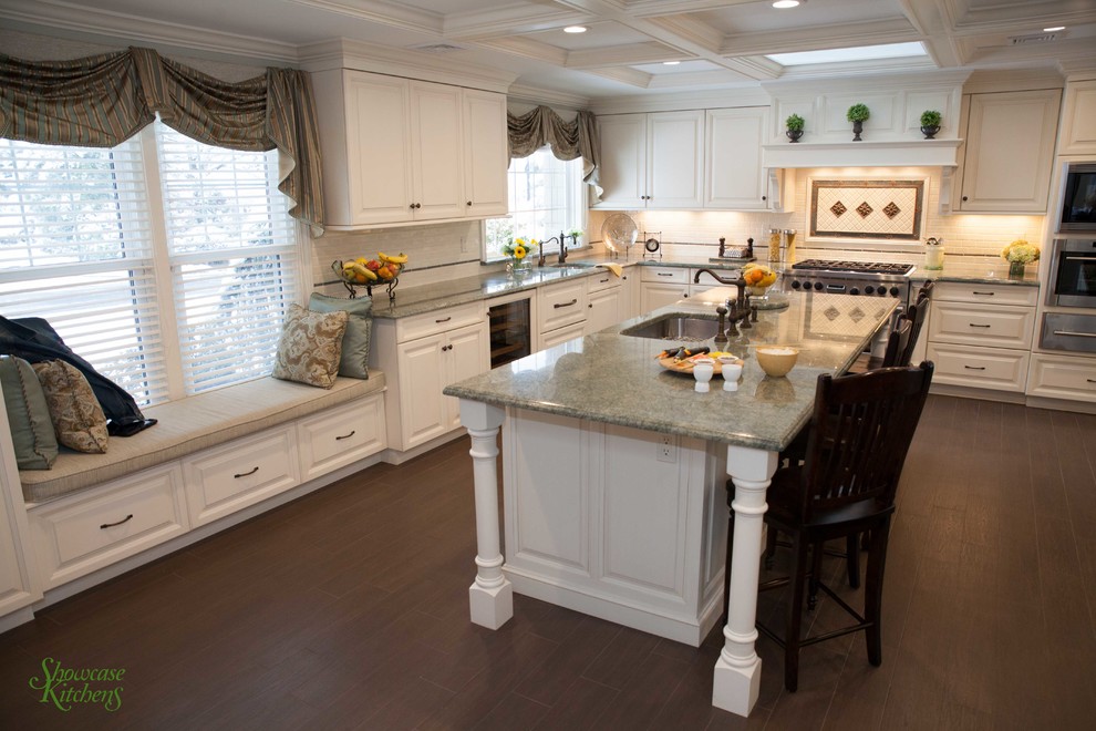 This is an example of a large traditional l-shaped eat-in kitchen in New York with an undermount sink, raised-panel cabinets, white cabinets, granite benchtops, stainless steel appliances, porcelain floors and with island.