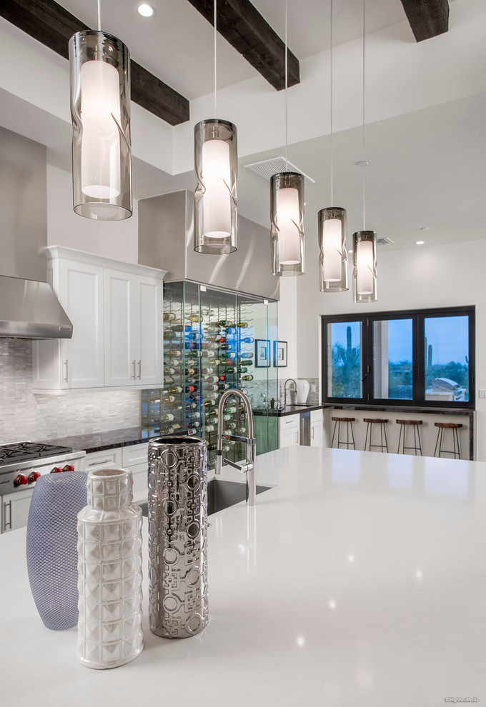 Inspiration for a transitional dark wood floor kitchen remodel in Phoenix with an undermount sink, shaker cabinets, dark wood cabinets, marble countertops, gray backsplash, stainless steel appliances and an island