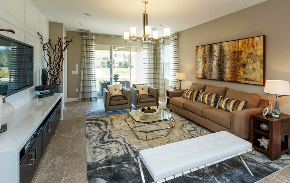 Inspiration for a transitional family room in Orlando with beige walls and panelled walls.