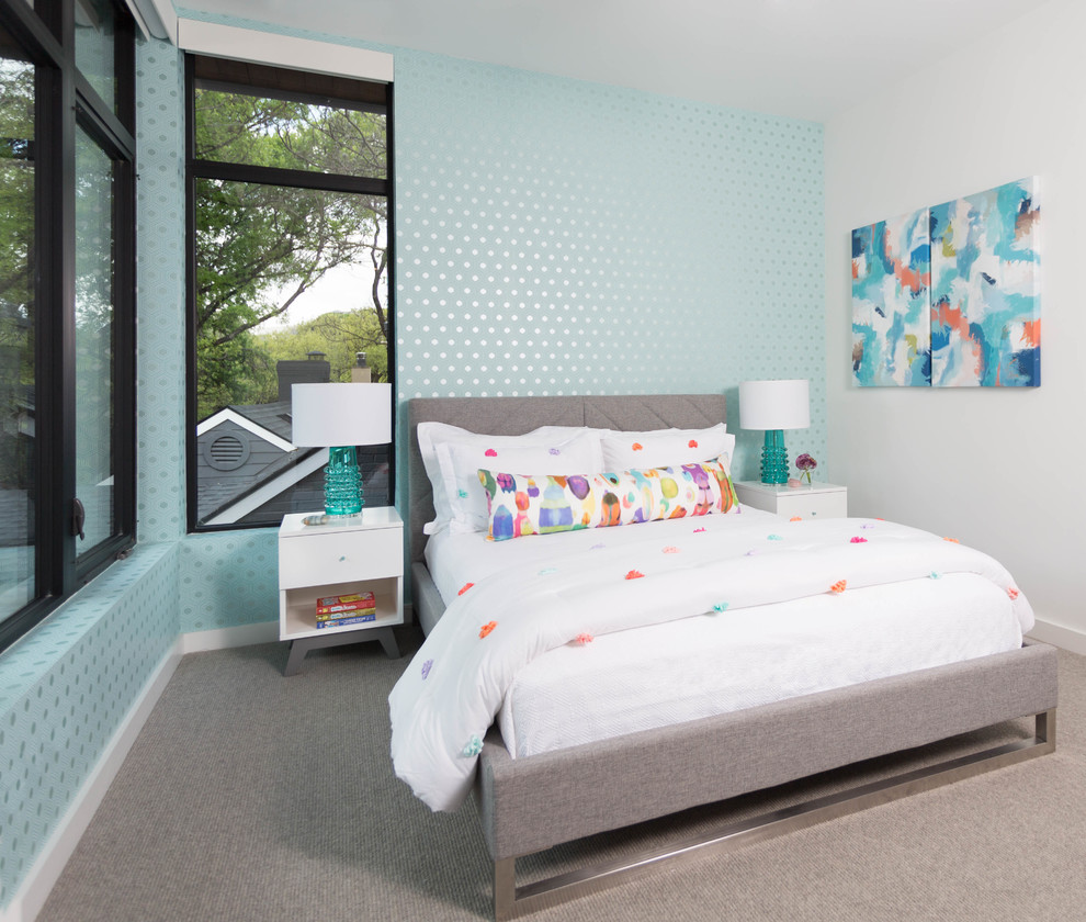 Design ideas for a mid-sized modern kids' room for girls in Austin with white walls and carpet.