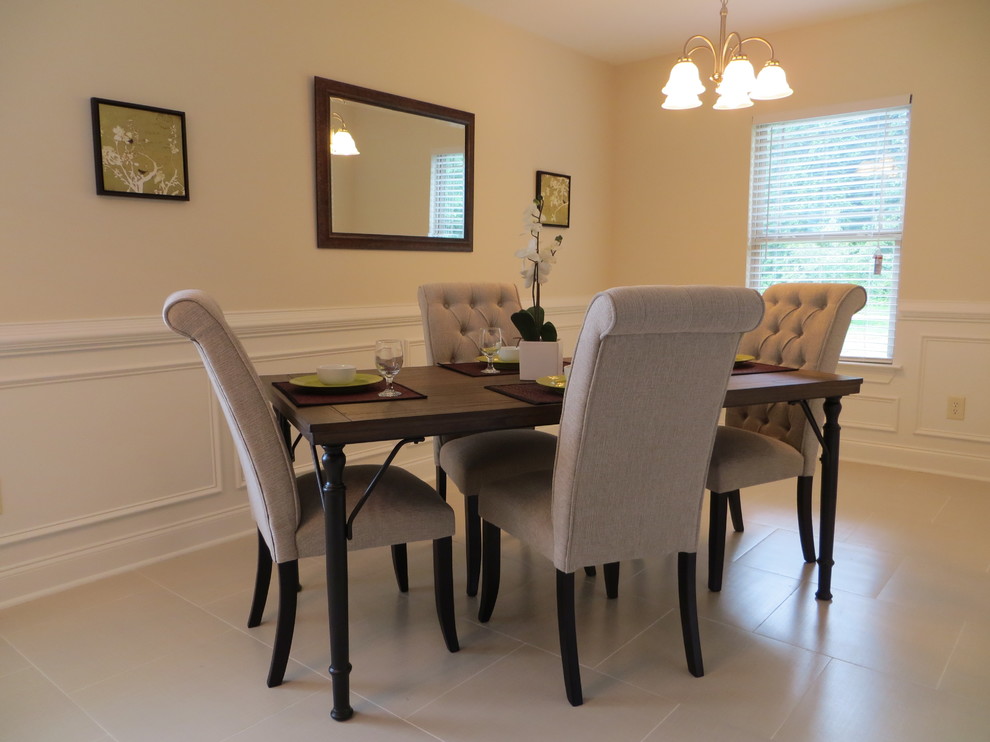Example of a mid-sized transitional porcelain tile and gray floor enclosed dining room design with beige walls and no fireplace