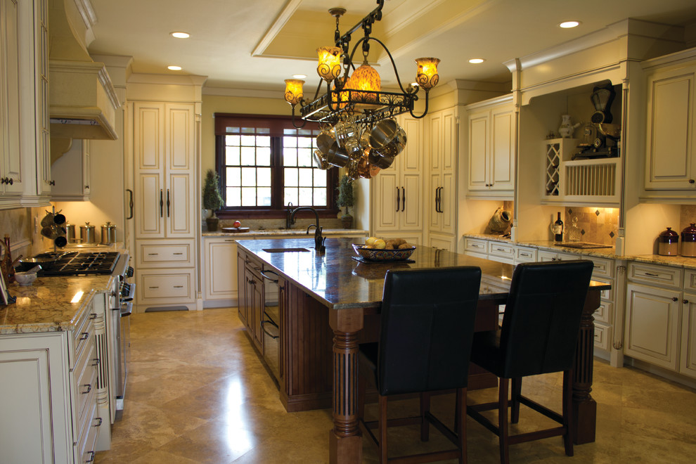 Traditional u-shaped kitchen in Miami with raised-panel cabinets, beige cabinets, beige splashback and beige floor.