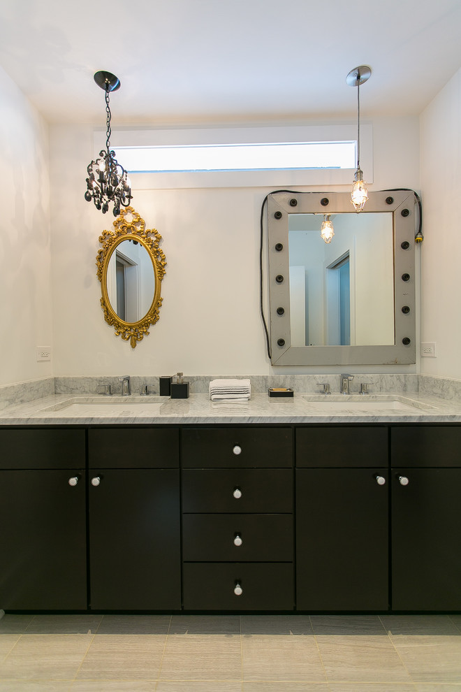 Photo of a large transitional bathroom in Chicago with flat-panel cabinets, dark wood cabinets, marble benchtops, an alcove tub and a two-piece toilet.