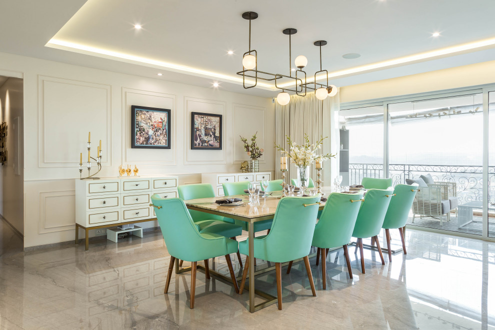 Photo of a contemporary dining room in Mumbai with white walls, concrete floors and grey floor.