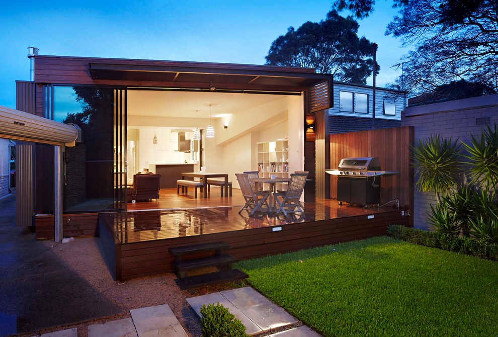 This is an example of a small contemporary backyard full sun garden in Melbourne with decking.