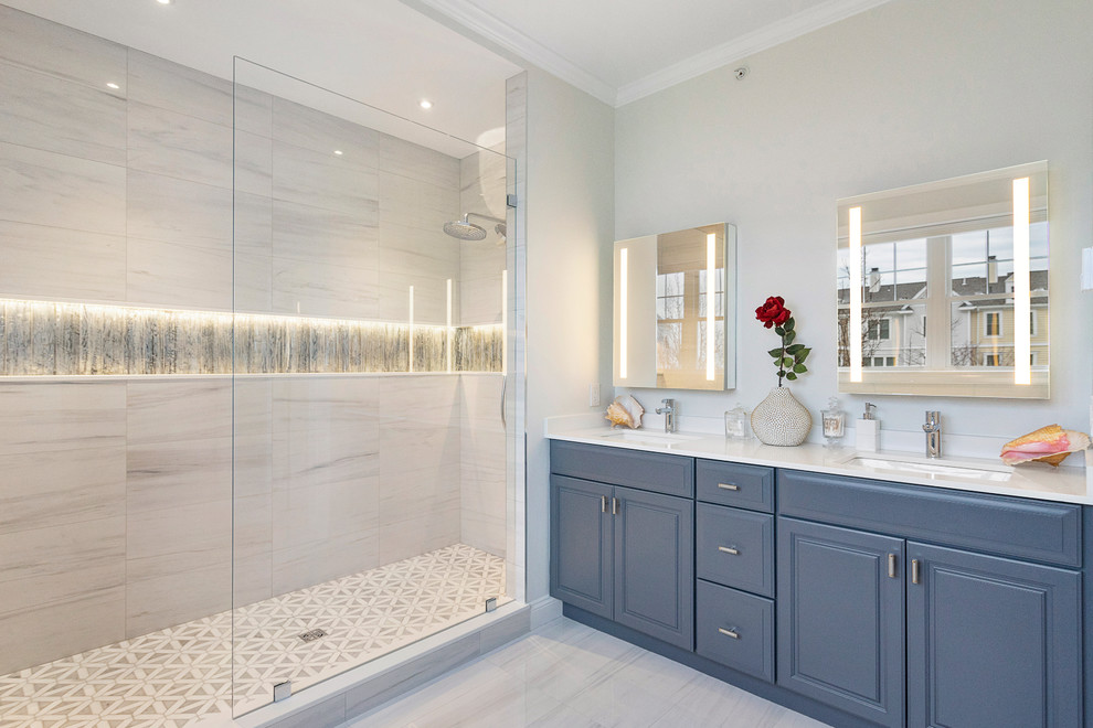 Mid-sized transitional master bathroom in Boston with raised-panel cabinets, grey cabinets, an alcove shower, gray tile, porcelain tile, grey walls, porcelain floors, an undermount sink, engineered quartz benchtops, grey floor, an open shower and white benchtops.