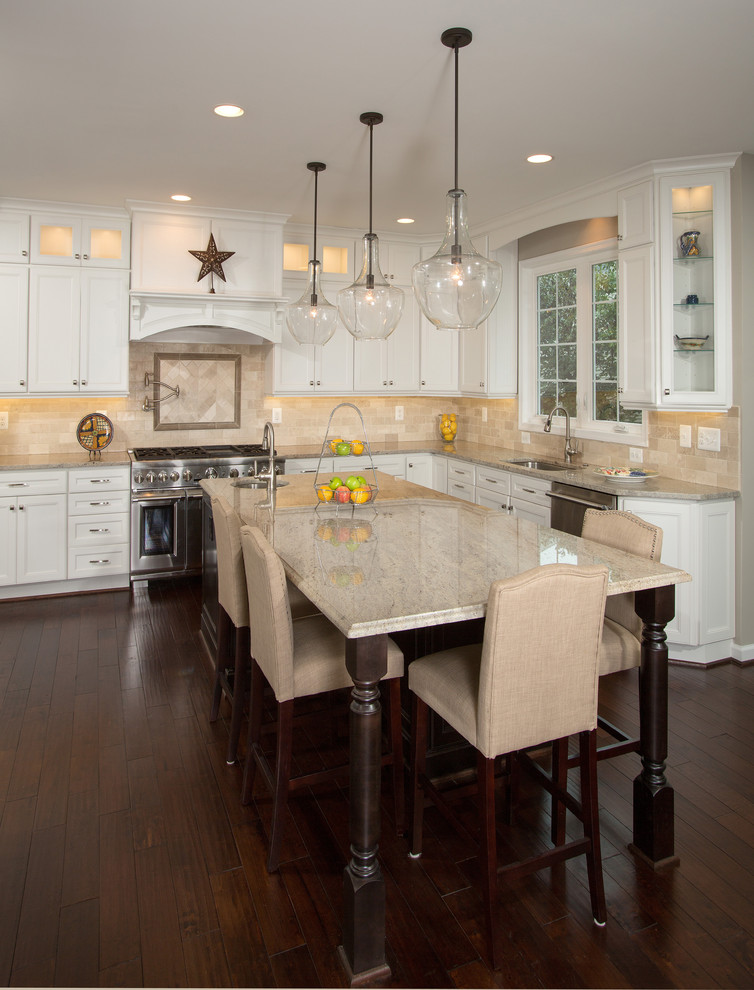 Design ideas for a large transitional l-shaped open plan kitchen in DC Metro with an undermount sink, white cabinets, beige splashback, stainless steel appliances, dark hardwood floors, with island, shaker cabinets, granite benchtops and ceramic splashback.
