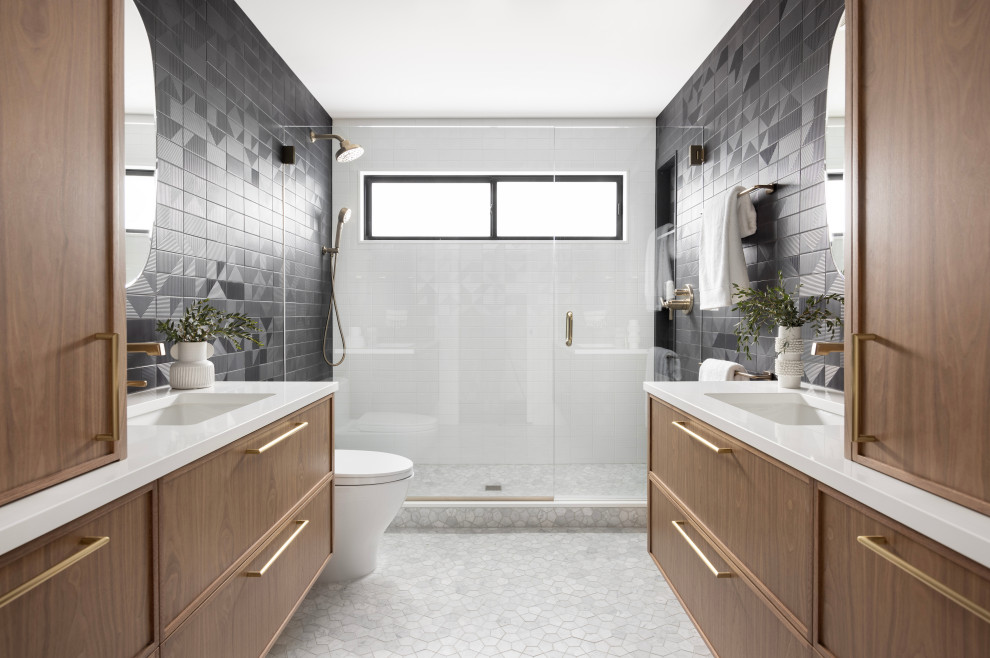 Alcove shower - large 1950s master black tile and ceramic tile mosaic tile floor, gray floor and double-sink alcove shower idea in Portland with flat-panel cabinets, medium tone wood cabinets, a one-piece toilet, black walls, an undermount sink, quartz countertops, a hinged shower door, white countertops, a niche and a floating vanity