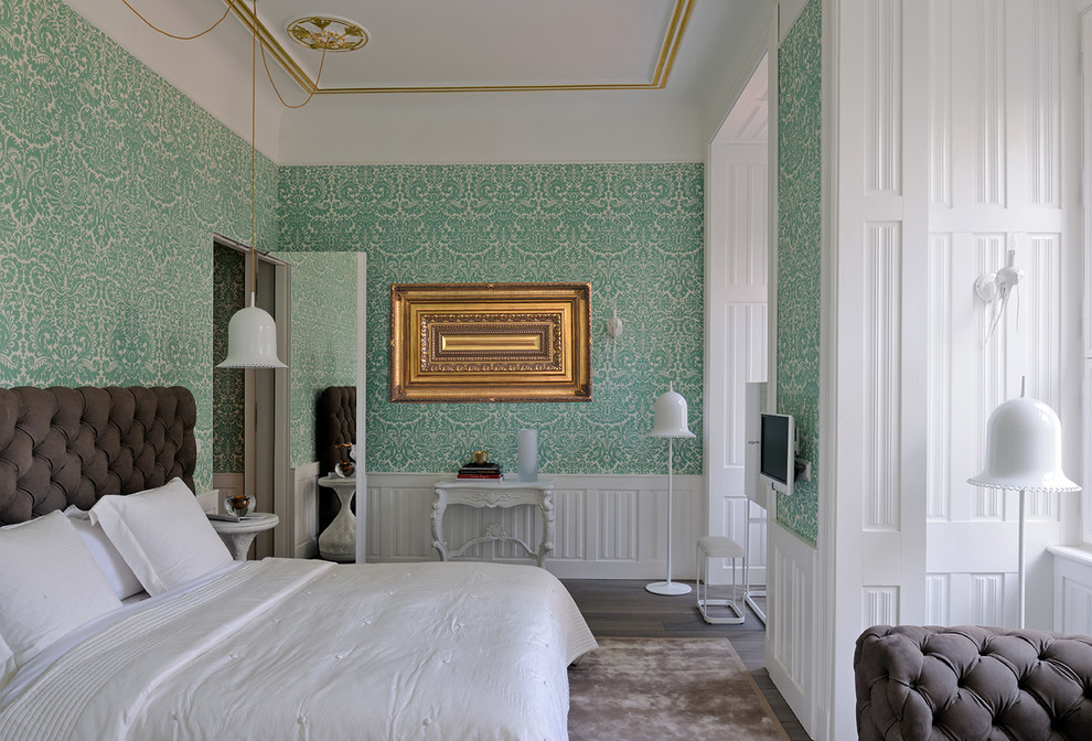 Inspiration for a mid-sized traditional master bedroom in Paris with multi-coloured walls and dark hardwood floors.