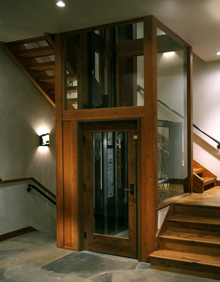 Large contemporary foyer in Other with beige walls, slate floors, a single front door and a dark wood front door.