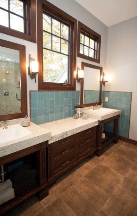 Inspiration for a transitional terra-cotta tile bathroom remodel with a drop-in sink, open cabinets, dark wood cabinets and granite countertops
