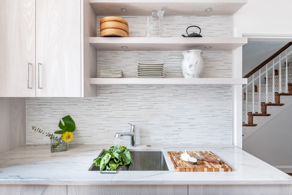 Inspiration for a small scandinavian galley separate kitchen in DC Metro with flat-panel cabinets, distressed cabinets, quartzite benchtops, green splashback, matchstick tile splashback, panelled appliances, no island and green benchtop.