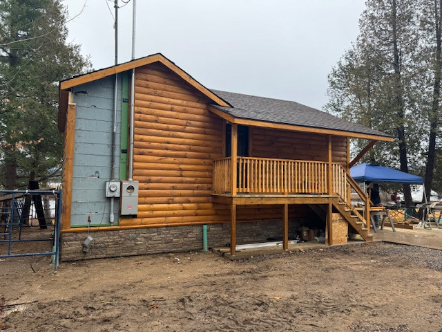 Log Siding, Stamped Concrete and Post and Beam Carport