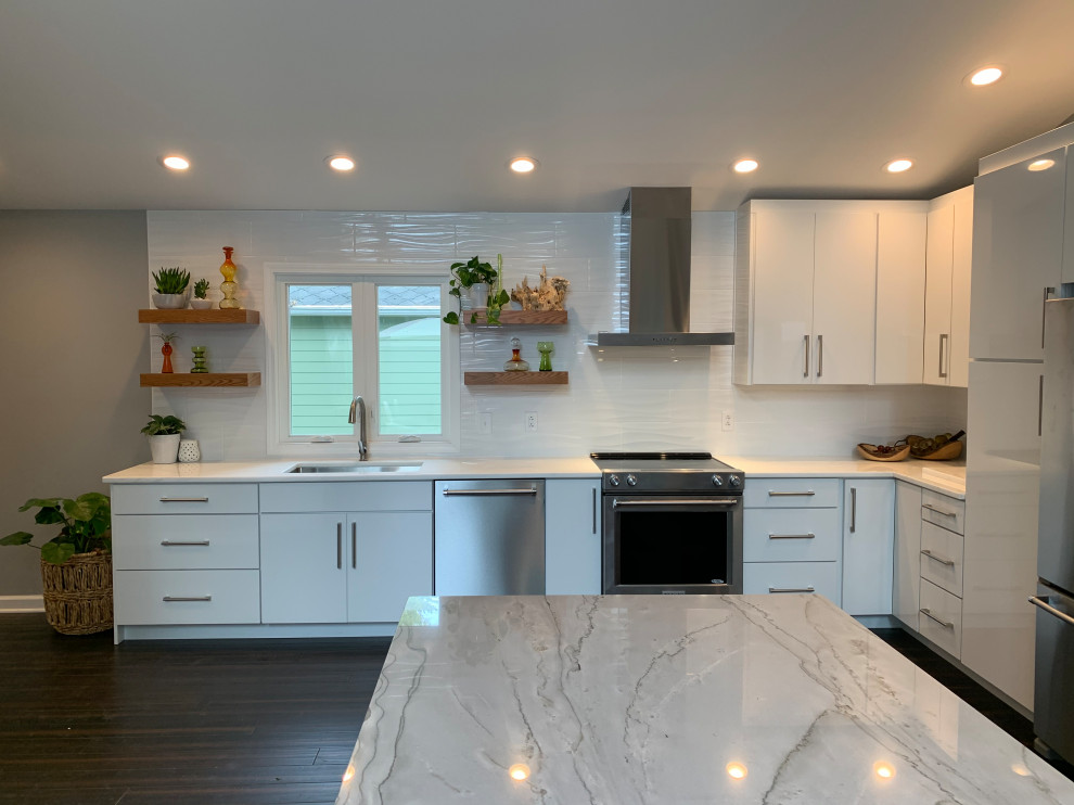 Design ideas for a large midcentury u-shaped eat-in kitchen in Other with an undermount sink, flat-panel cabinets, white cabinets, marble benchtops, stainless steel appliances, with island, brown floor and white benchtop.