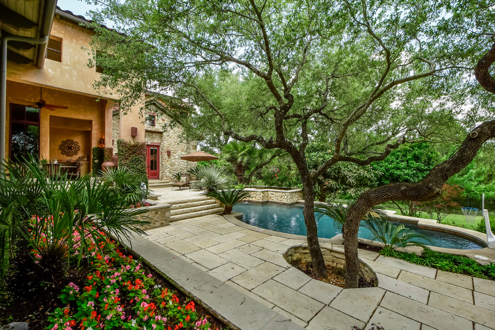 Tuscan home design photo in Austin