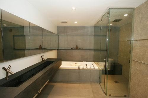 Inspiration for a large modern master limestone floor corner shower remodel in San Francisco with a trough sink