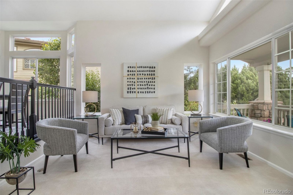 Example of a transitional home design design in Denver