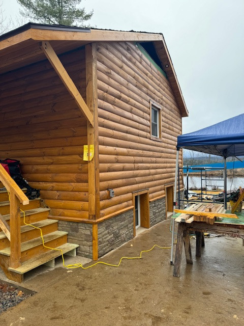 Log Siding, Stamped Concrete and Post and Beam Carport