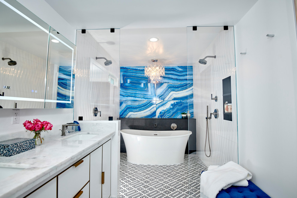 Example of a large minimalist master blue tile and porcelain tile marble floor, black floor, double-sink and wall paneling bathroom design in Denver with flat-panel cabinets, white cabinets, a one-piece toilet, white walls, an undermount sink, marble countertops, white countertops, a niche and a freestanding vanity