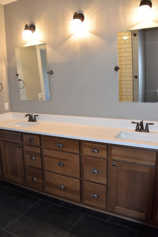 Bathroom - large transitional master black floor bathroom idea with raised-panel cabinets, medium tone wood cabinets, gray walls and an undermount sink