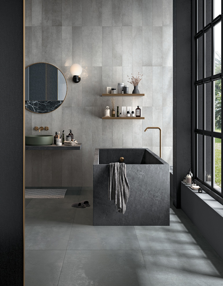 Inspiration for a contemporary bathroom in Perth with a freestanding tub, gray tile, porcelain tile, porcelain floors, a vessel sink, grey floor, a single vanity and a floating vanity.