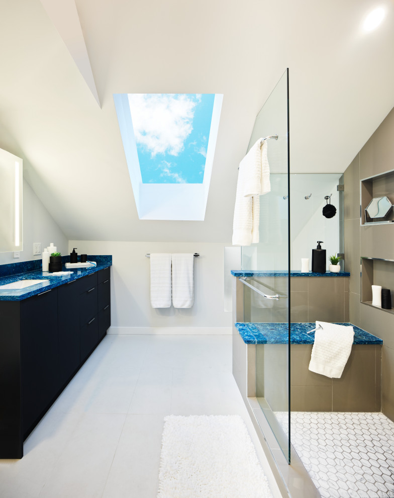 Photo of a small modern master bathroom in Vancouver with furniture-like cabinets, dark wood cabinets, an alcove shower, gray tile, porcelain tile, white walls, bamboo floors, an undermount sink, quartzite benchtops, beige floor, a hinged shower door, blue benchtops, a shower seat, a single vanity, a built-in vanity and vaulted.