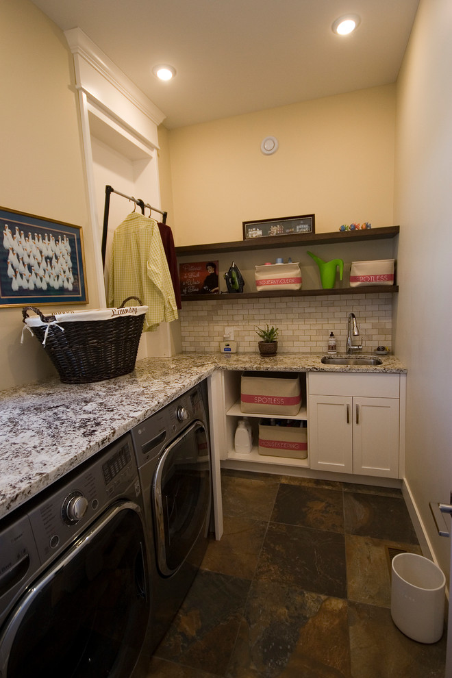 Small transitional l-shaped utility room photo with an undermount sink, shaker cabinets, white cabinets, granite countertops, beige walls and a side-by-side washer/dryer