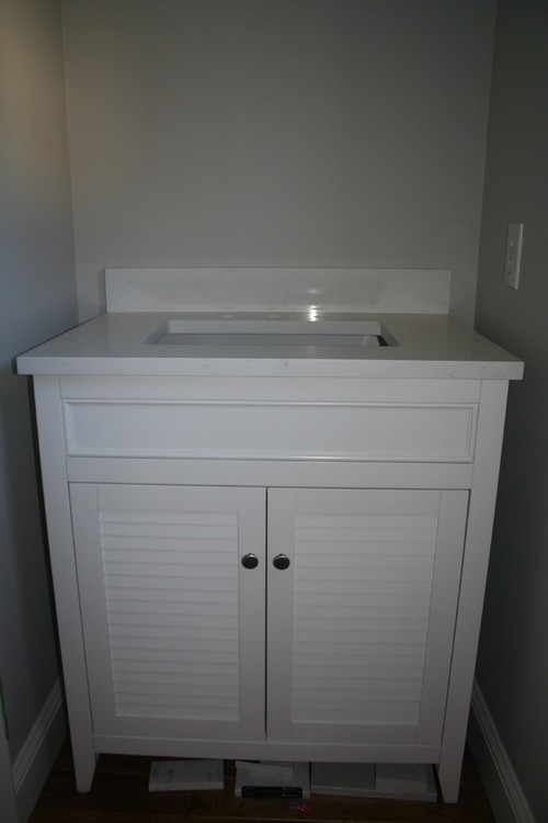 What's the standard overhang on a vanity top w/a w/inset door?