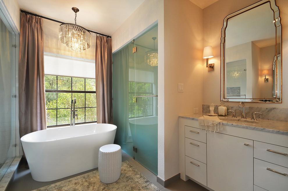 Transitional bathroom in Austin with a freestanding tub.