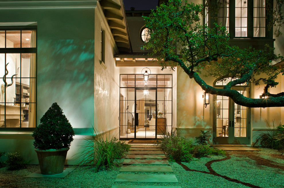 This is an example of a contemporary entryway in Austin with a single front door and a metal front door.