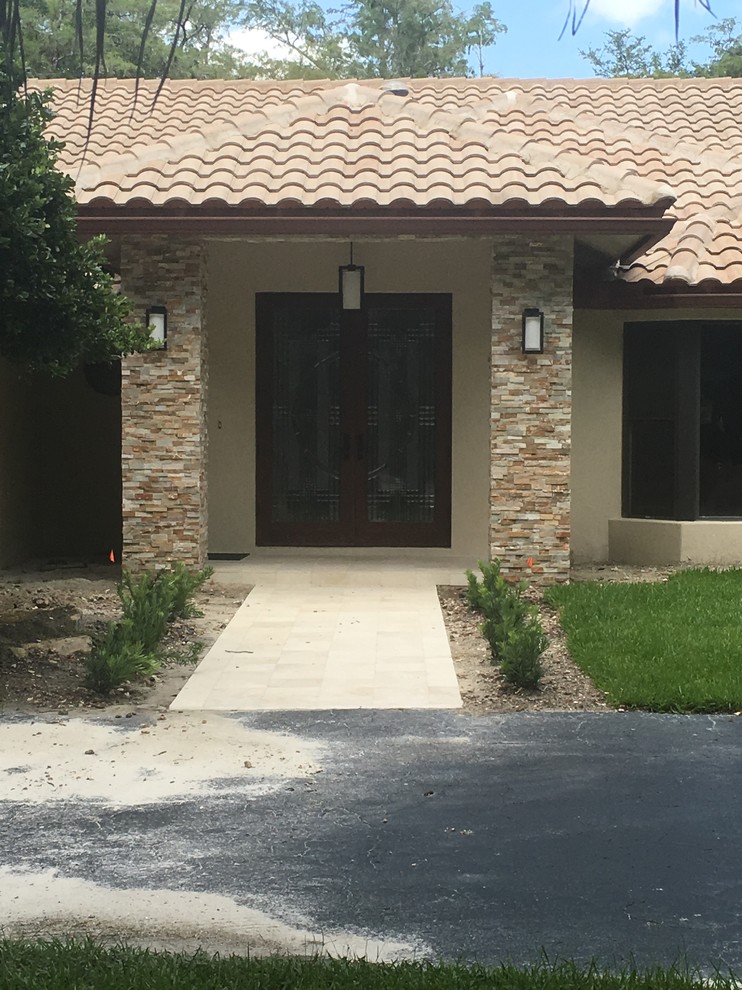 Mountain style entryway photo in Miami